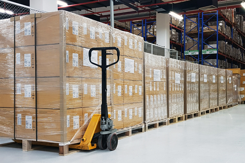 Stacks of subscription boxes in a warehouse.
